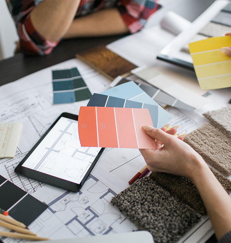 custom-basements-feature Comparing paint samples for Michigan home